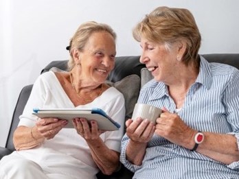 Two ladies talking with iPad